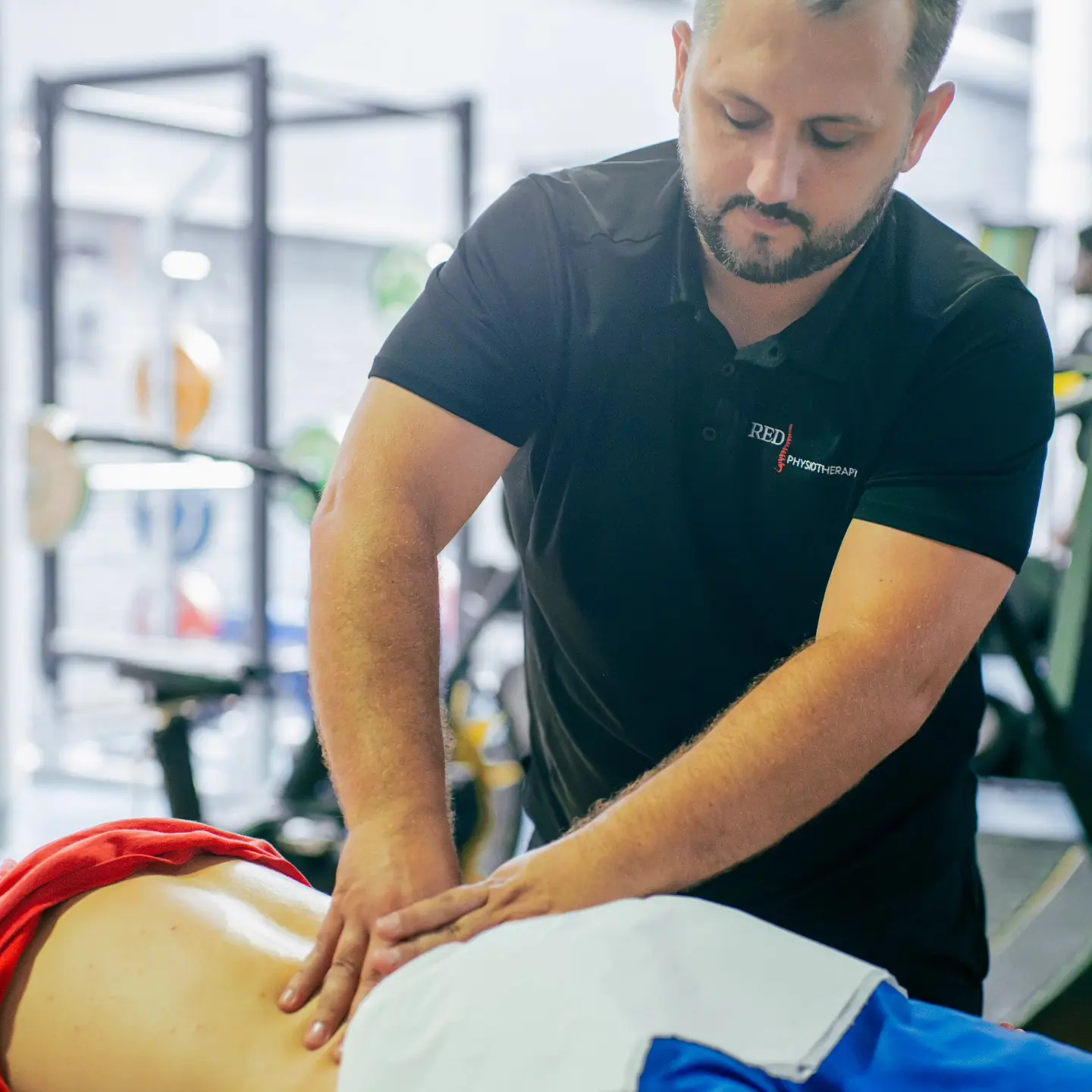 Physiotherapist providing hands-on treatment during first visit