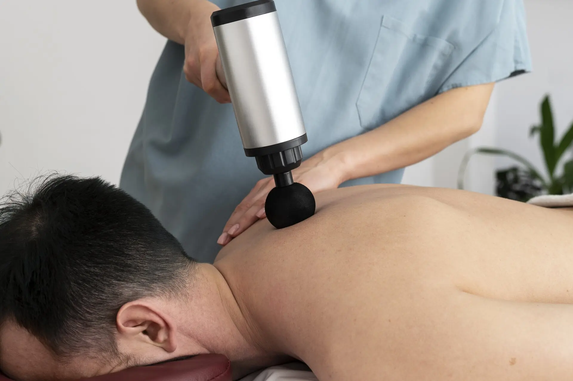 Advanced shockwave therapy treatment being administered to accelerate healing and reduce chronic pain in patients