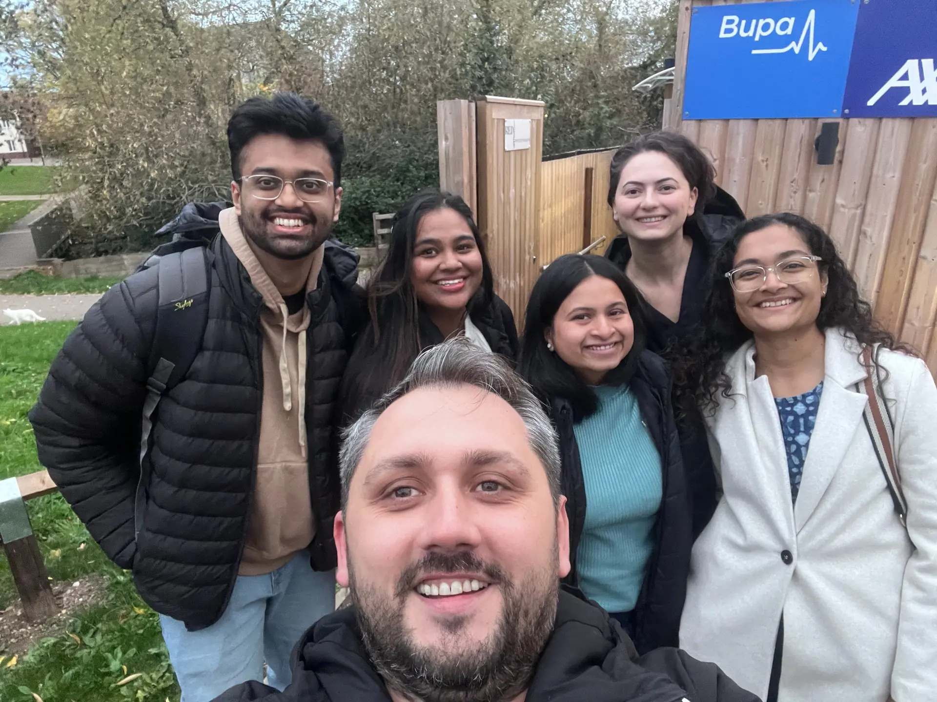 RED Physiotherapy team at a stadium event - Diana, Daniel, Rashi, Sakshi, and team members together